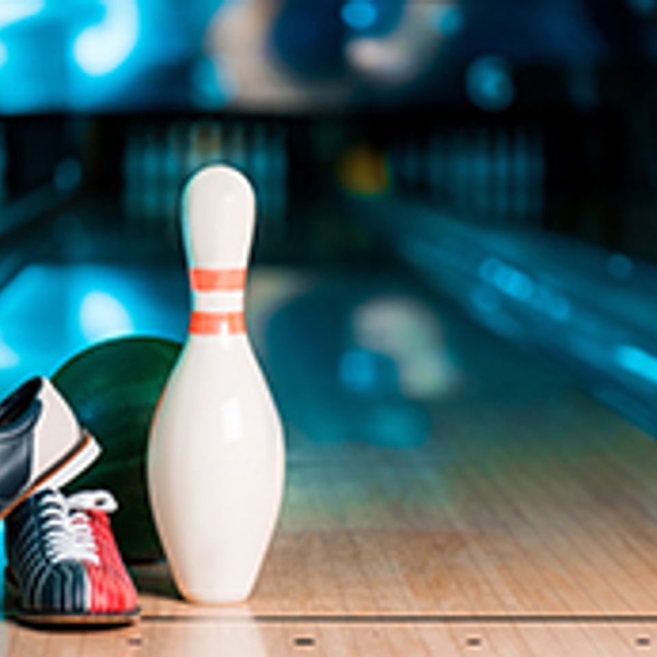 Bowling pin and shows on the alley