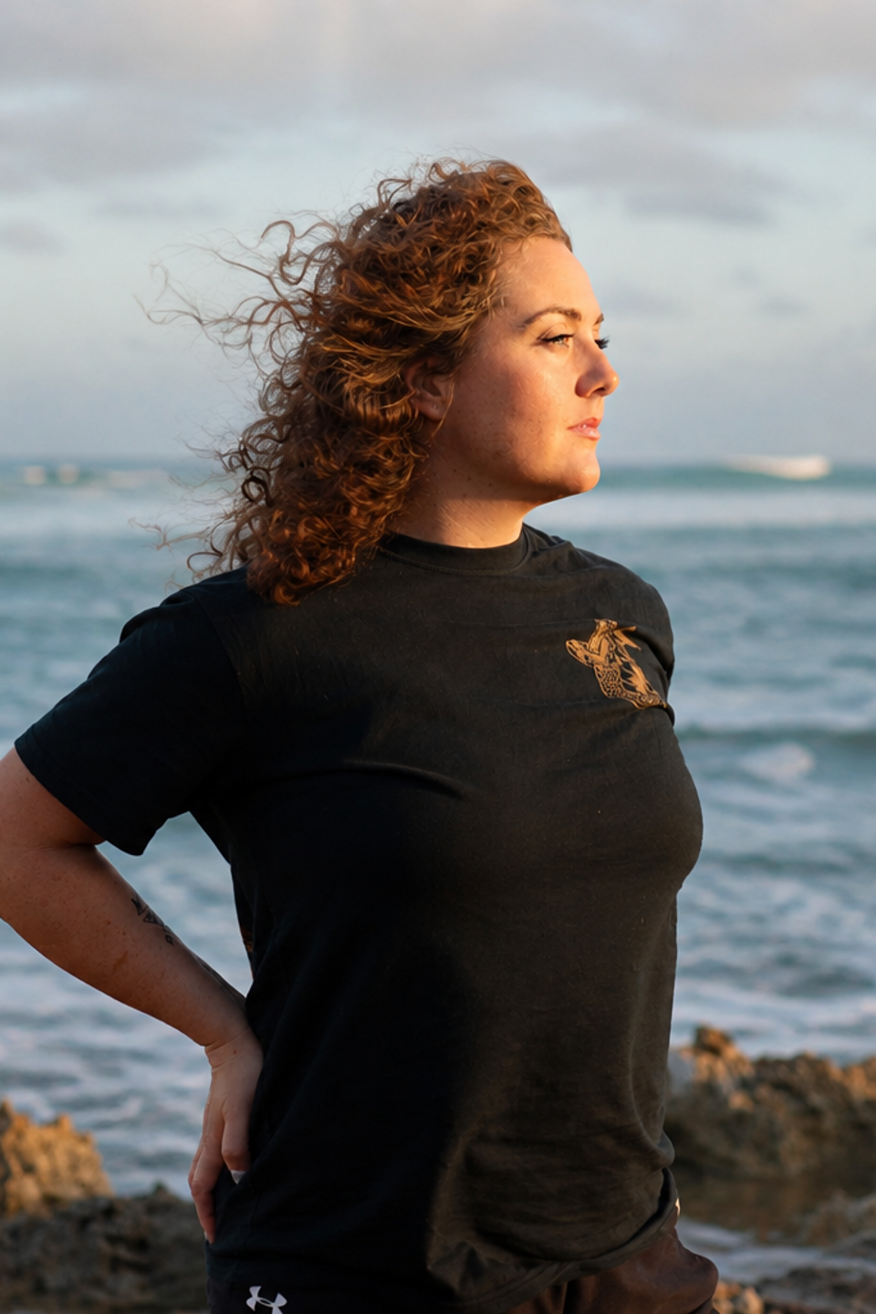 Founder of Bridging Wellness Crystal Looking over the ocean