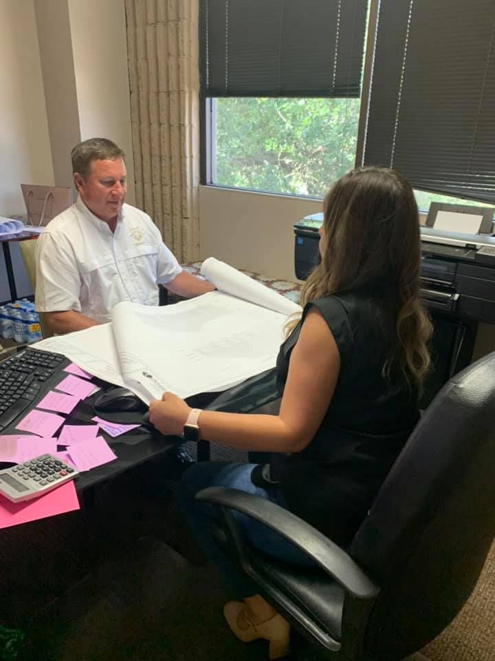 Nadel design   nancy delgado showing final blueprint to contractor