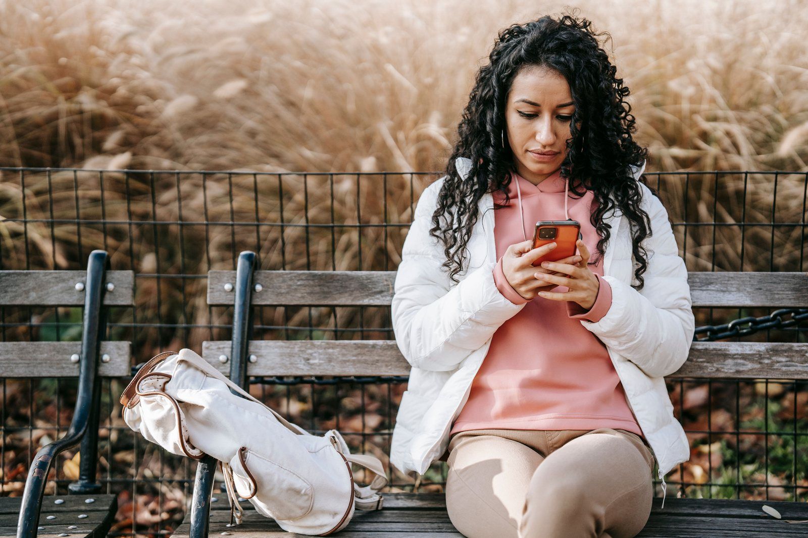 Customer reading a text message offer from a local business on her phone