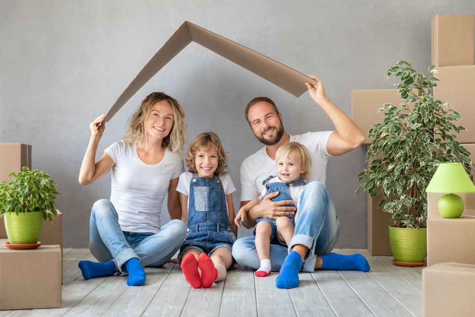 Young family moving boxes