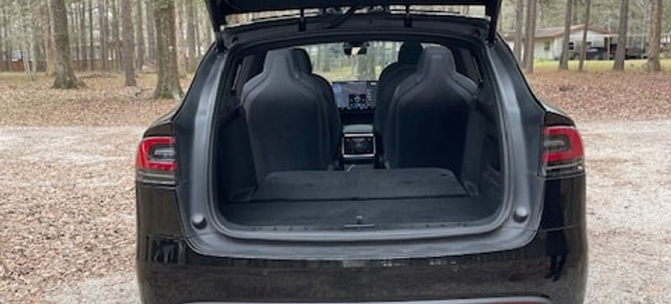Tesla model x   rear hatch open and seats down   further away min