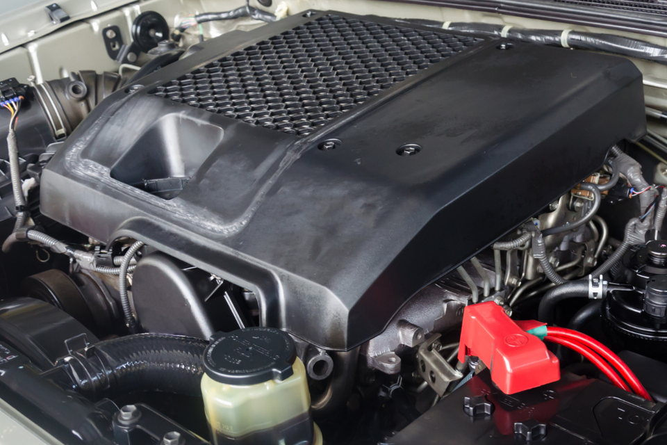 Close-up of a vehicle engine during routine maintenance and inspection.