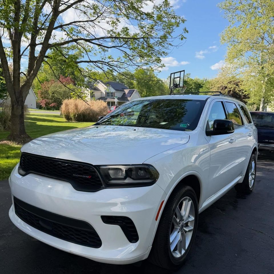 White Dodge Durango with a bright gloss finish after exterior cleaning in a Wilmington Delaware neighborhood
