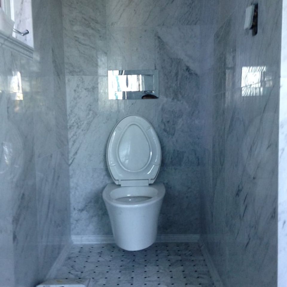 Wall mounted toilet installed house in palos verdes Ca