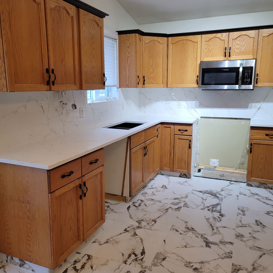 Wider angle view of kitchen stone countertop