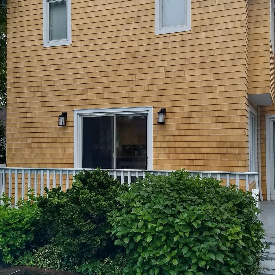 Cedar house siding job, A painted archway, done by Taurus Contracting Inc., of Suffolk County NY