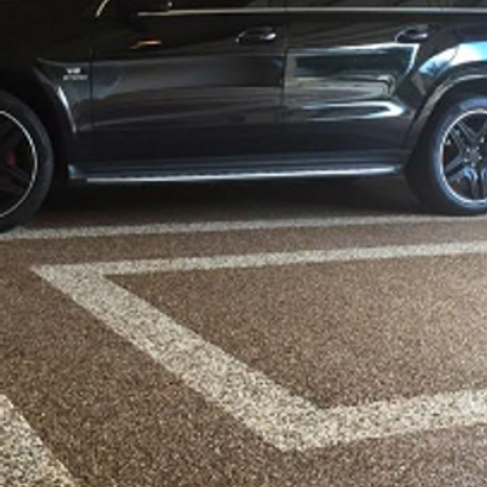 Decorative EverStone garage floor with parking space markings.