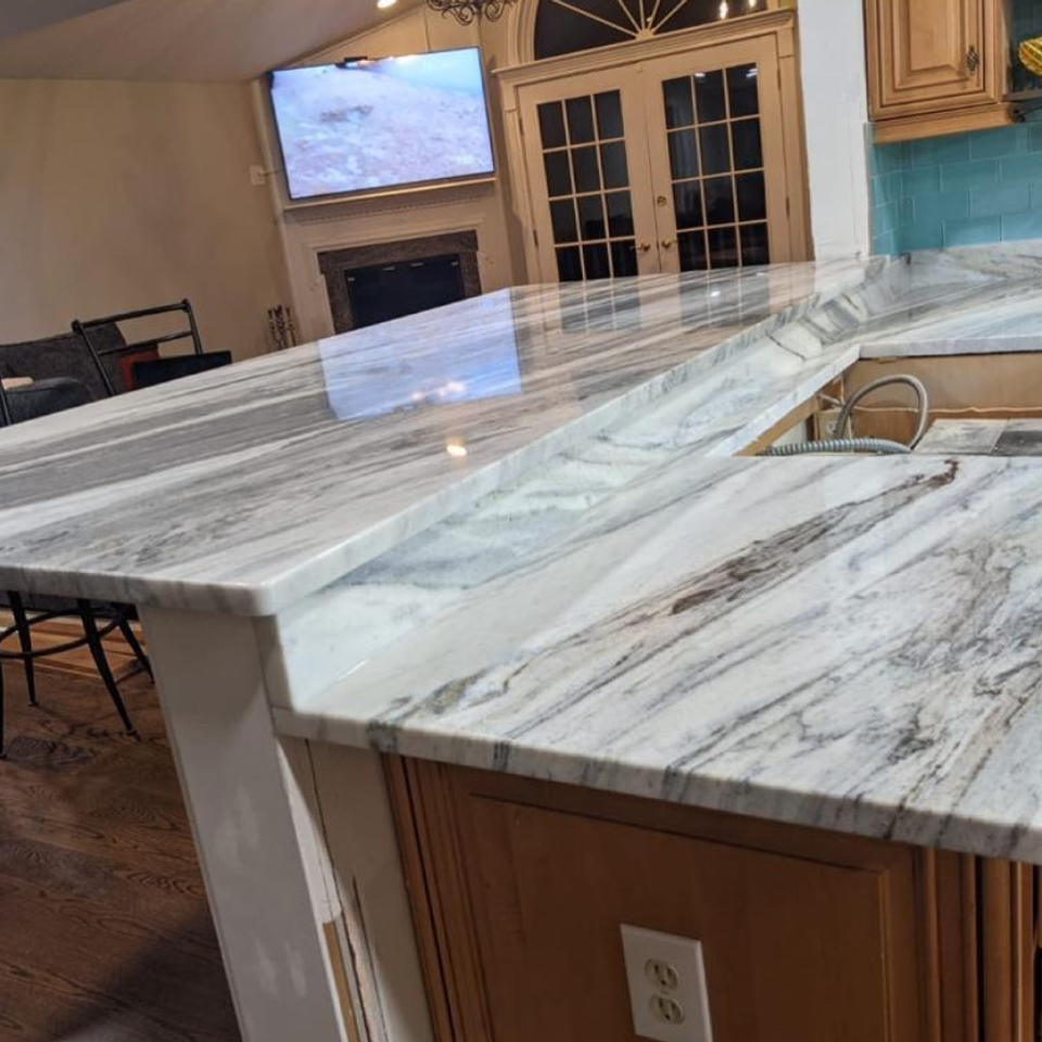 Marble waterfall kitchen island
