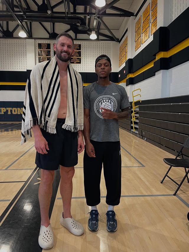 Xavier Allen with Kevin Love