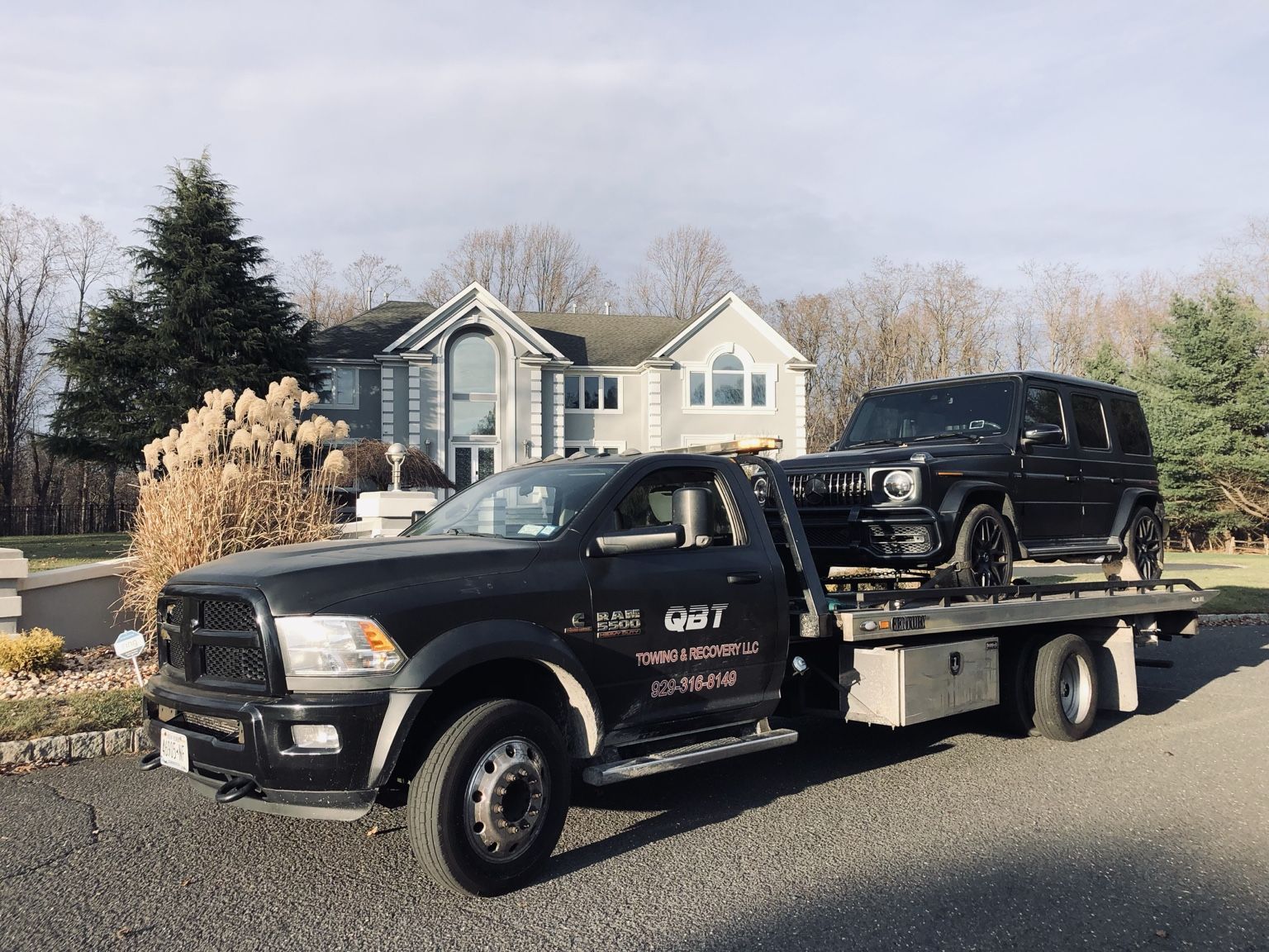 QBT tow truck on a residential street