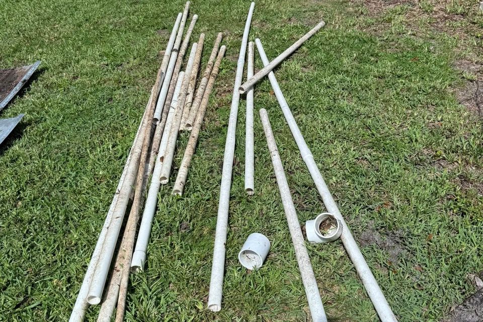 Scrap metal laid out on the grass