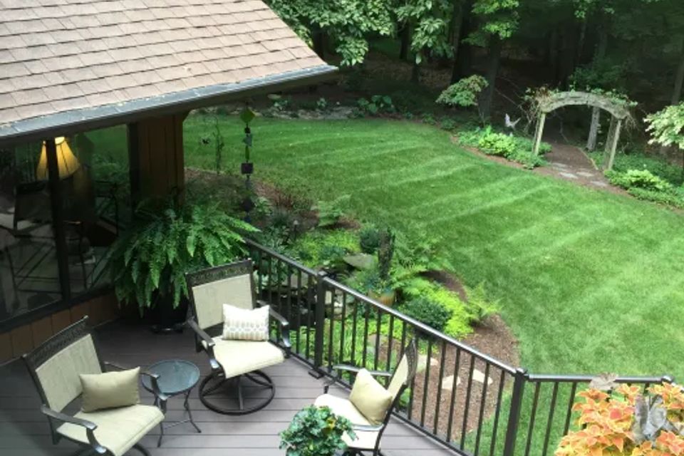 Gorgeous nw greensboro azek deck project featuring the color kona and chocolate aluminum rails