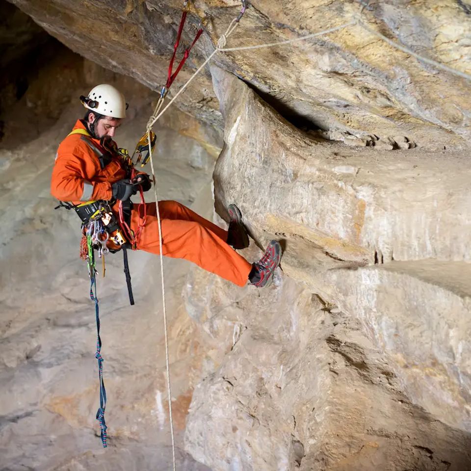 Vistacreate 199919934 stock photo speleologist performing rope maneuvers cave zaragoza province aragon spain