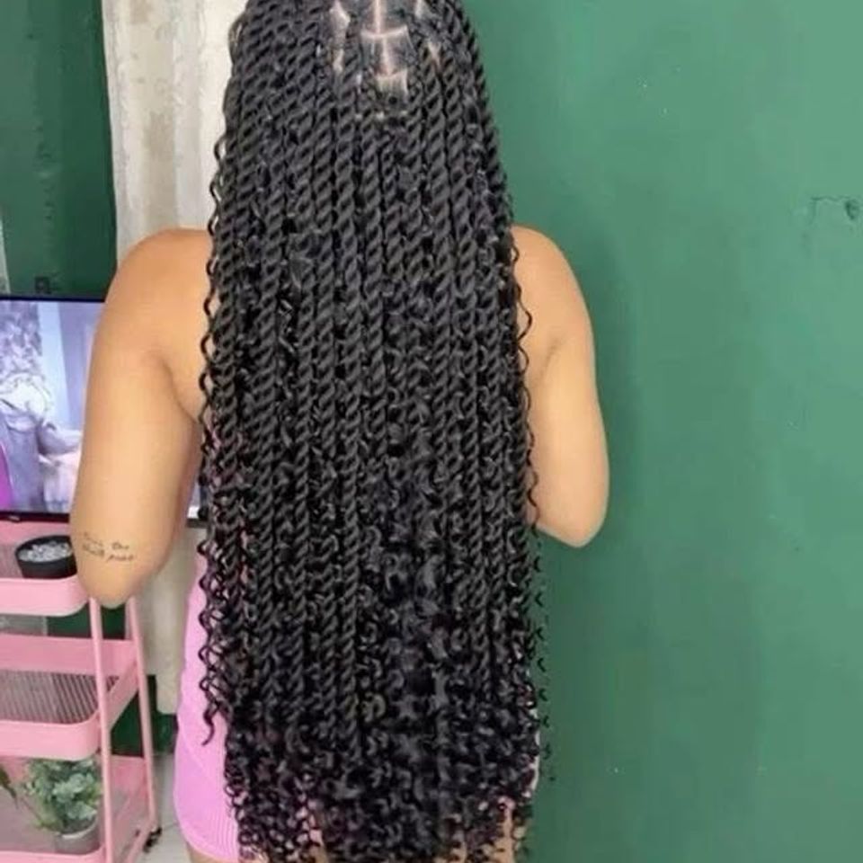 Long bohemian passion twists with curly ends after a braiding service in Los Angeles CA