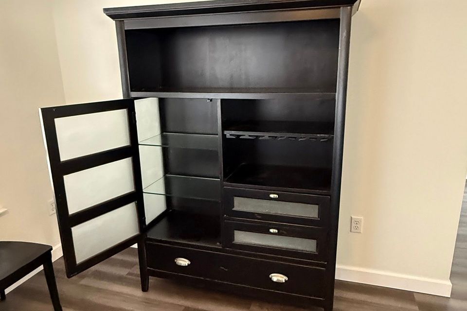 A black cabinet after being transported by JNJ Hauling Solutions of Citrus County
