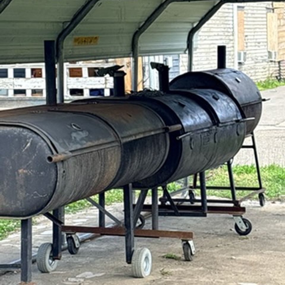 Custom-built BBQ pits used by Lickers Hometown BBQ to slow-cook authentic barbecue meats.