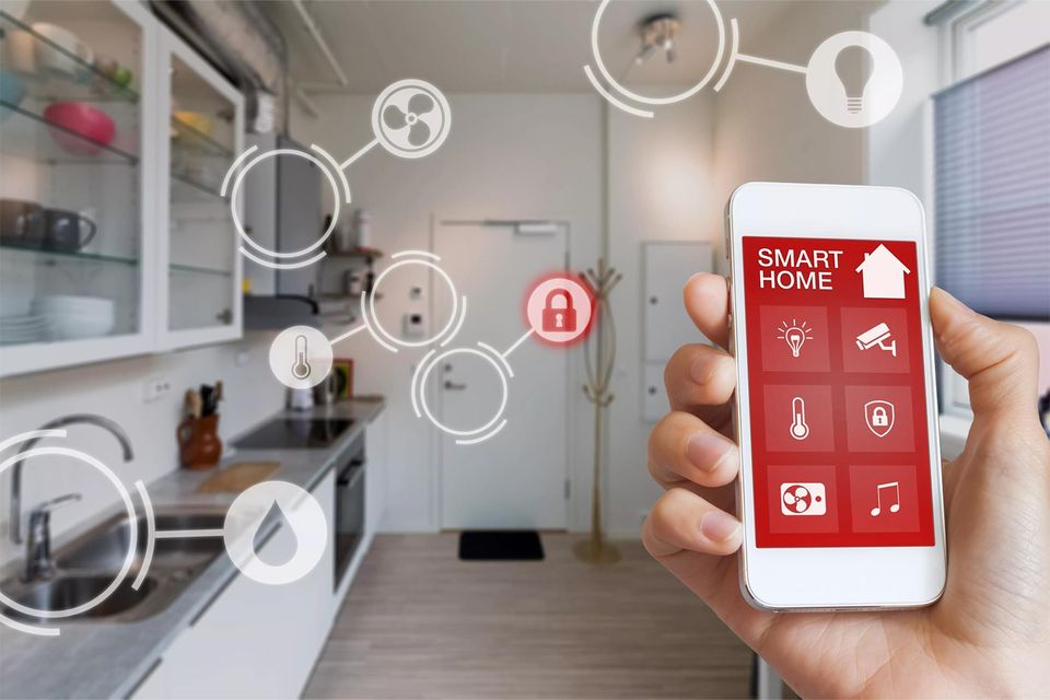 Homeowner using a smartphone app to control their smart home devices.