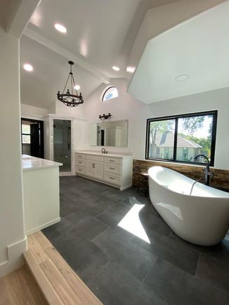 Bathroom with modern long soaking tub