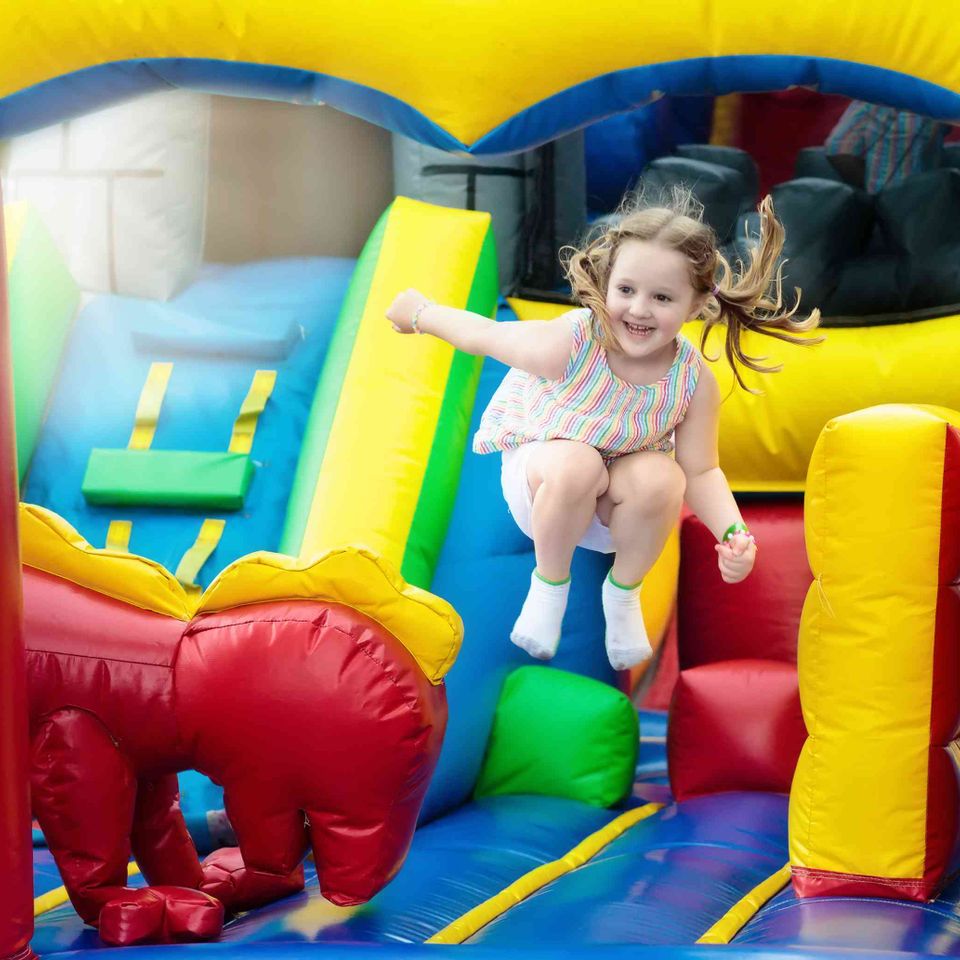 Child jumping on playground trampoline  kids jump  911352346 fa0e35e7b18945a3928e6f2bea998267
