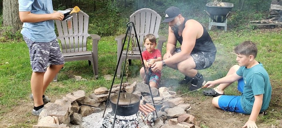 The Yoder family enjoys a good campfire.