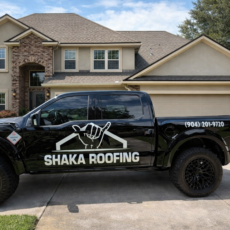 Truck in front of shingle home