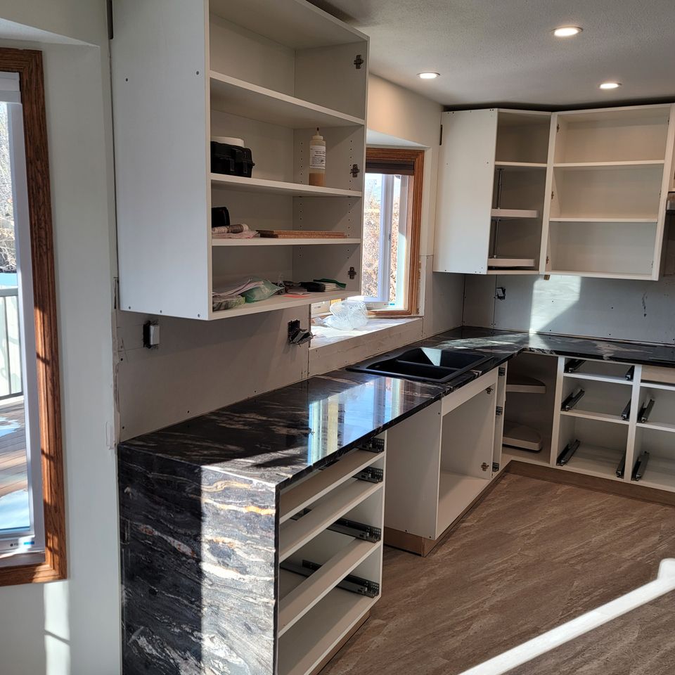 Stone Countertop over lots of drawers with cupboards above