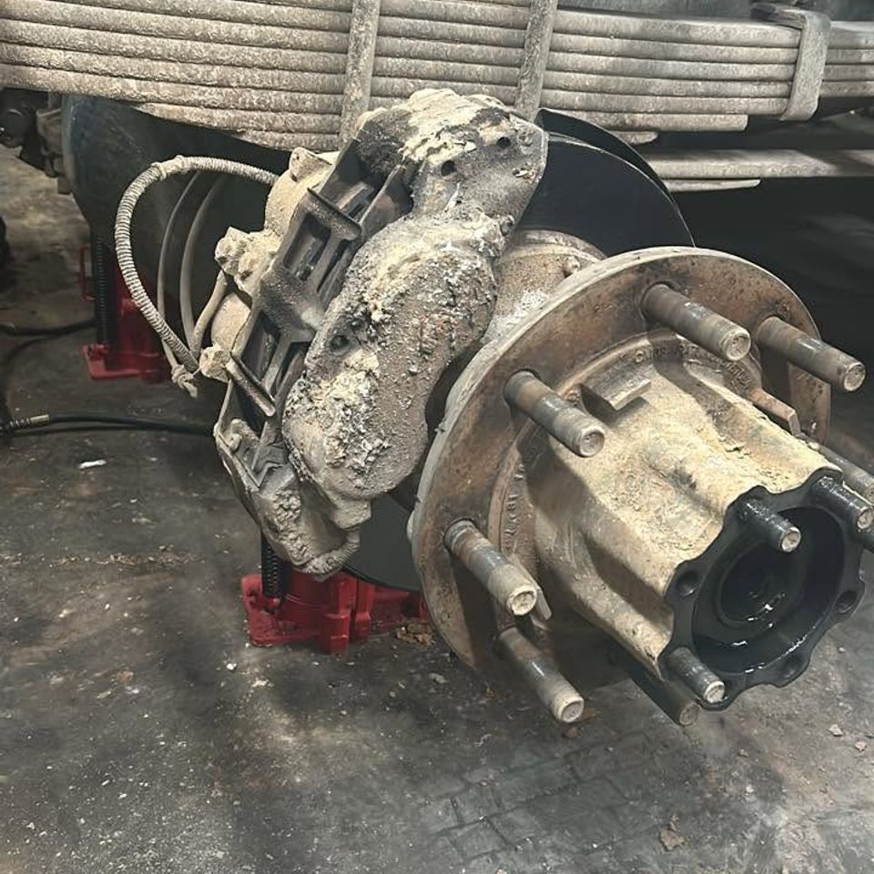 Heavy-duty truck brake caliper and hub assembly during brake service in Arab Alabama
