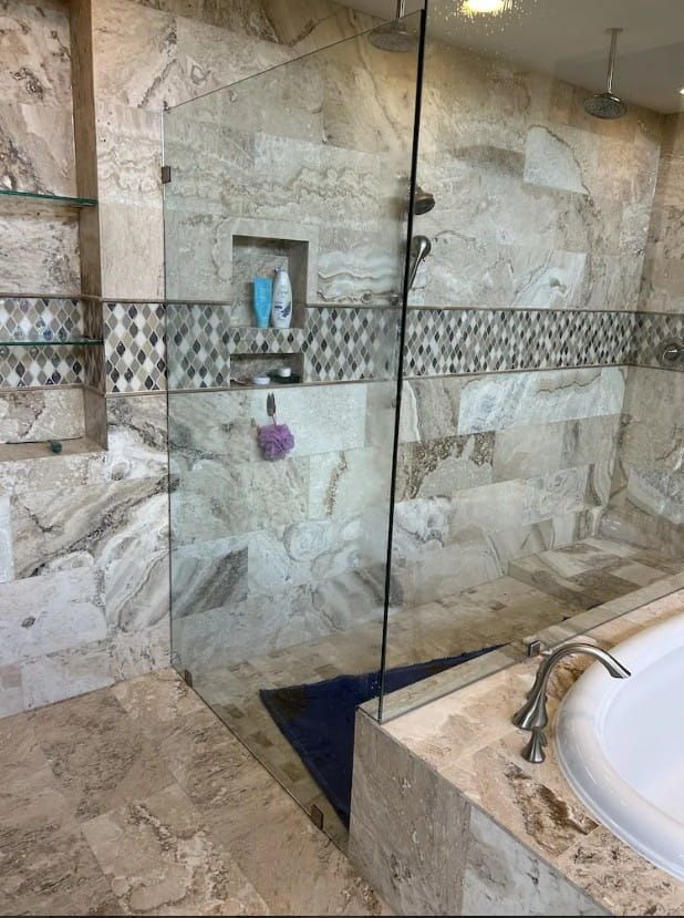 Clear glass shower enclosure before installation of frosted privacy window film in Sugar Land, TX.