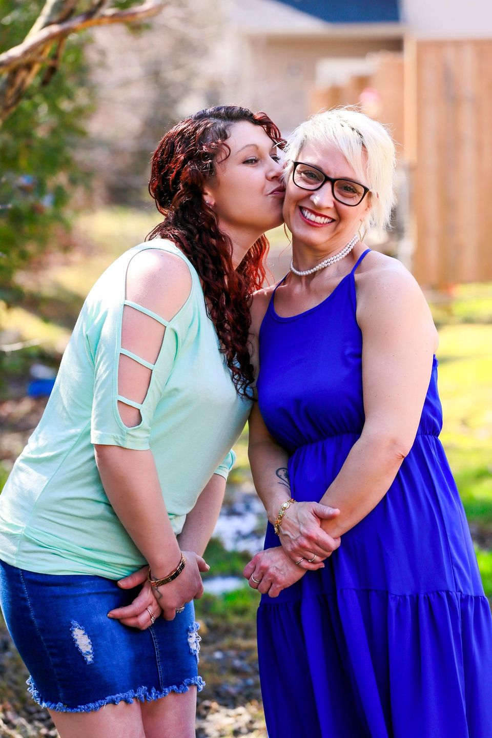 elderly woman smiling with non-medical caregiver in Sugar Land TX