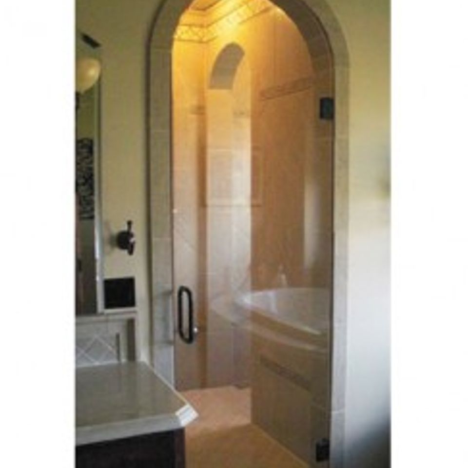 Frameless arched glass shower enclosure e1372203144559 243x300