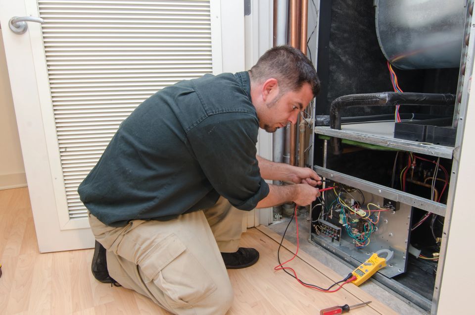 An HVAC tech working on a job