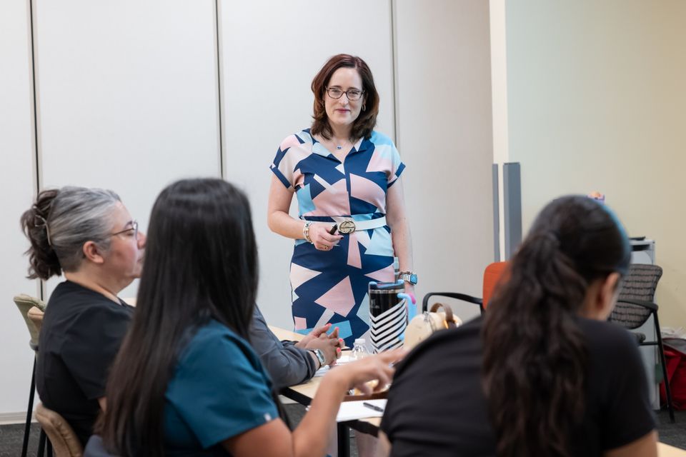 woman speaking to a group of people