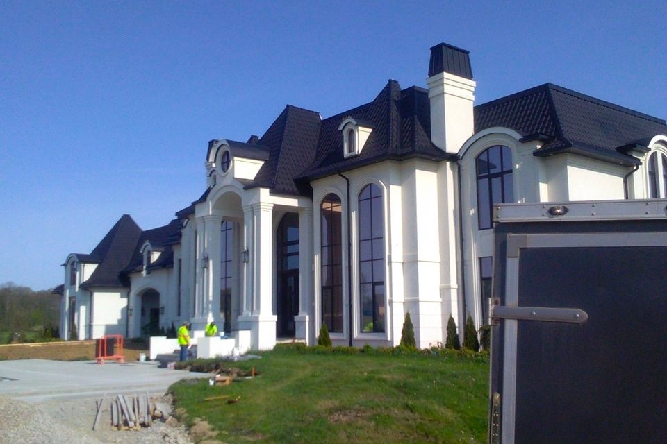 Large white luxury home exterior during an interior remodeling project in Chagrin Falls Ohio