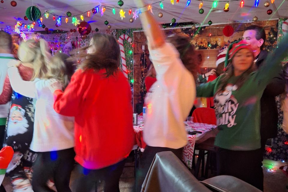People dancing and having fun at the Clark family holiday party