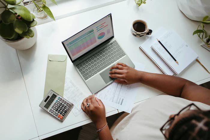 Above view of person at their desk working on laptop