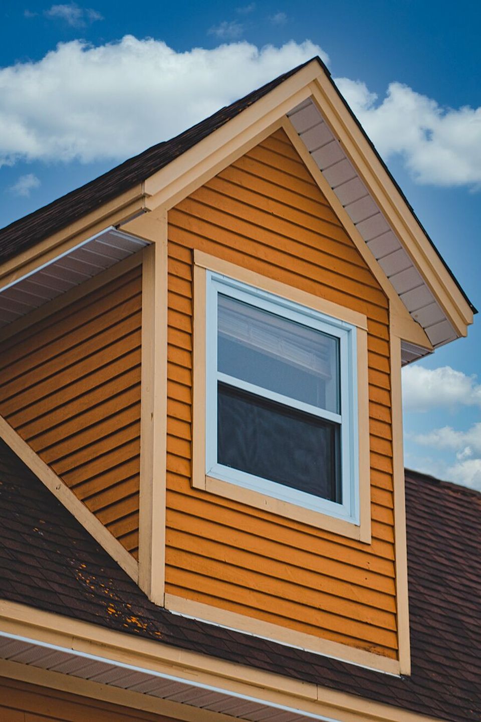 Nova Roofing + Construction LLC performing a high-precision glass replacement on a classic neighborhood residence to boost thermal efficiency and localized curb appeal.