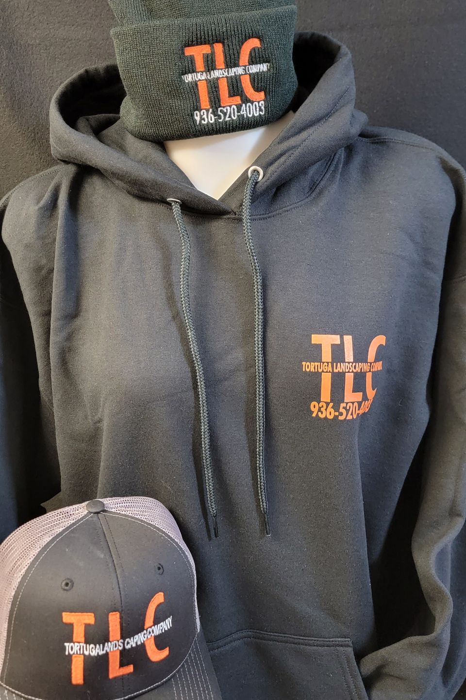 Heat Transfer vinyl and embroidery used for logo on sweatshirt, cap, and ski mask