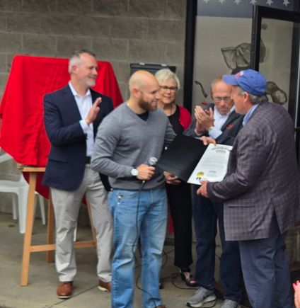 Al cutrona presents proclamation to tom mccabe