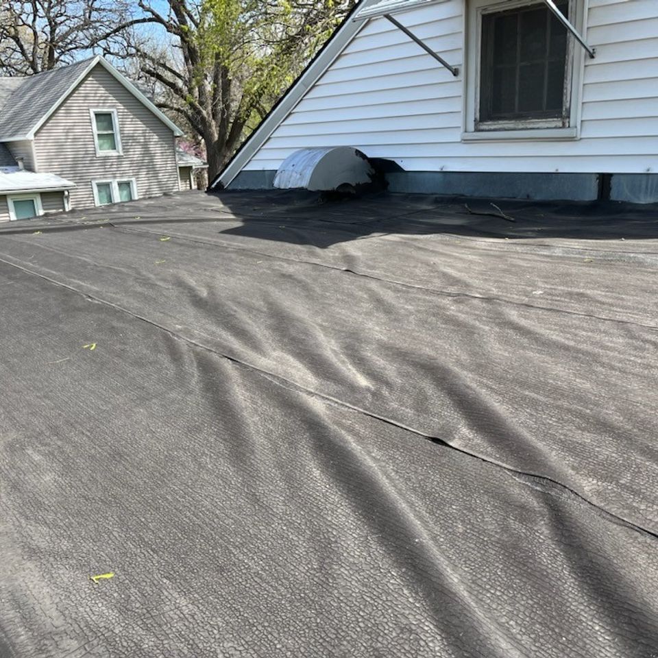 Grey flat roof wrinkles