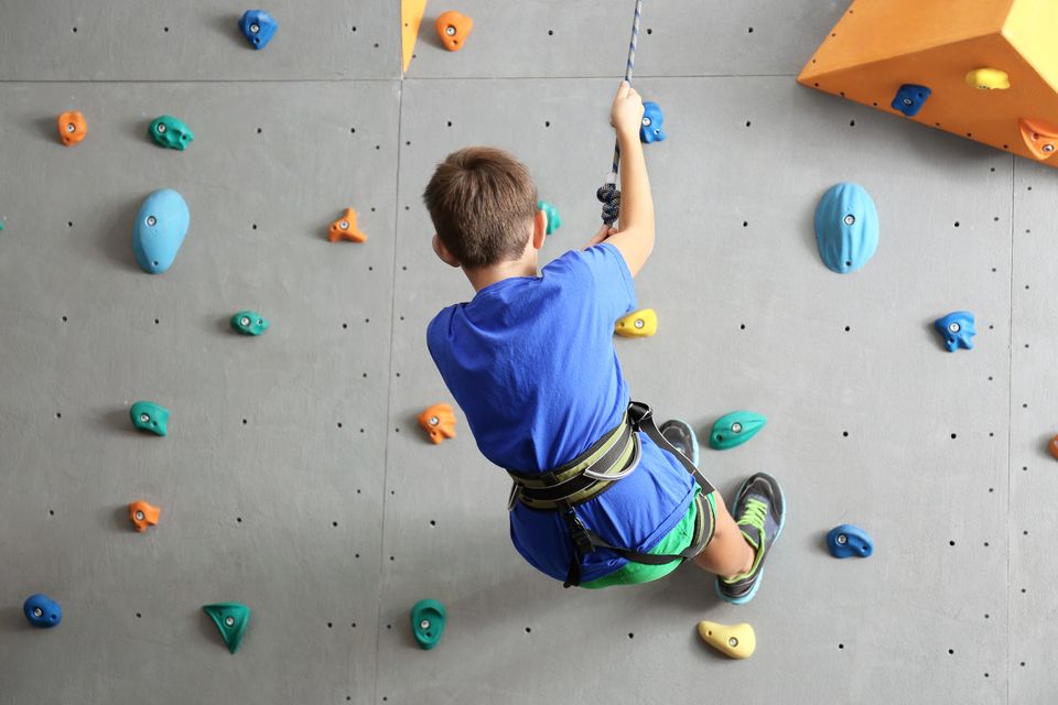 Shutterstock 762490516 boy on rockwall