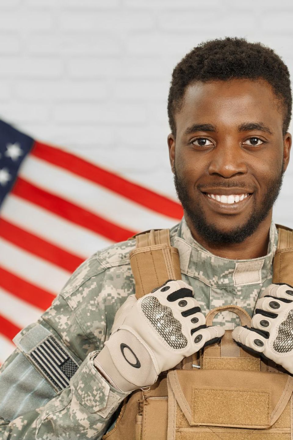 Happy soldier wearing americans army uniform armour