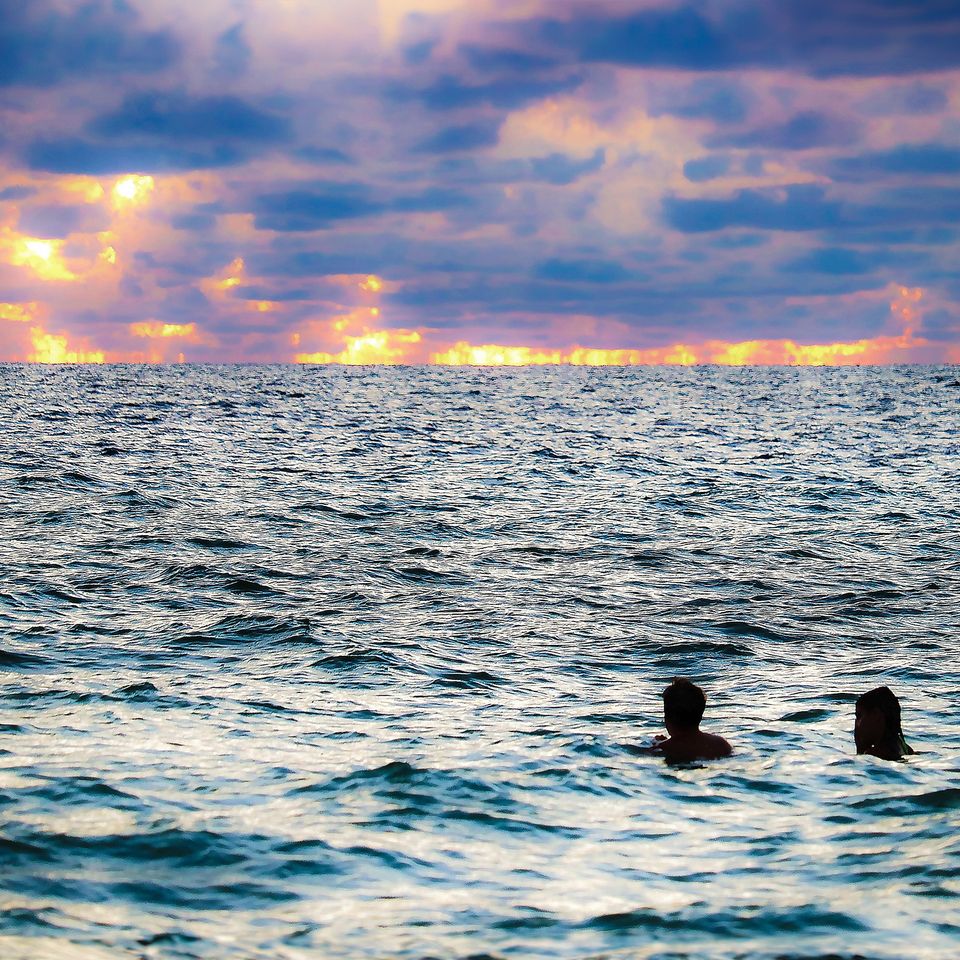 Sunset swimmers keep