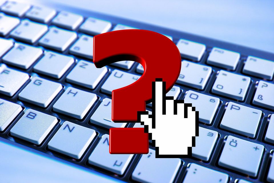 A keyboard with a red question mark