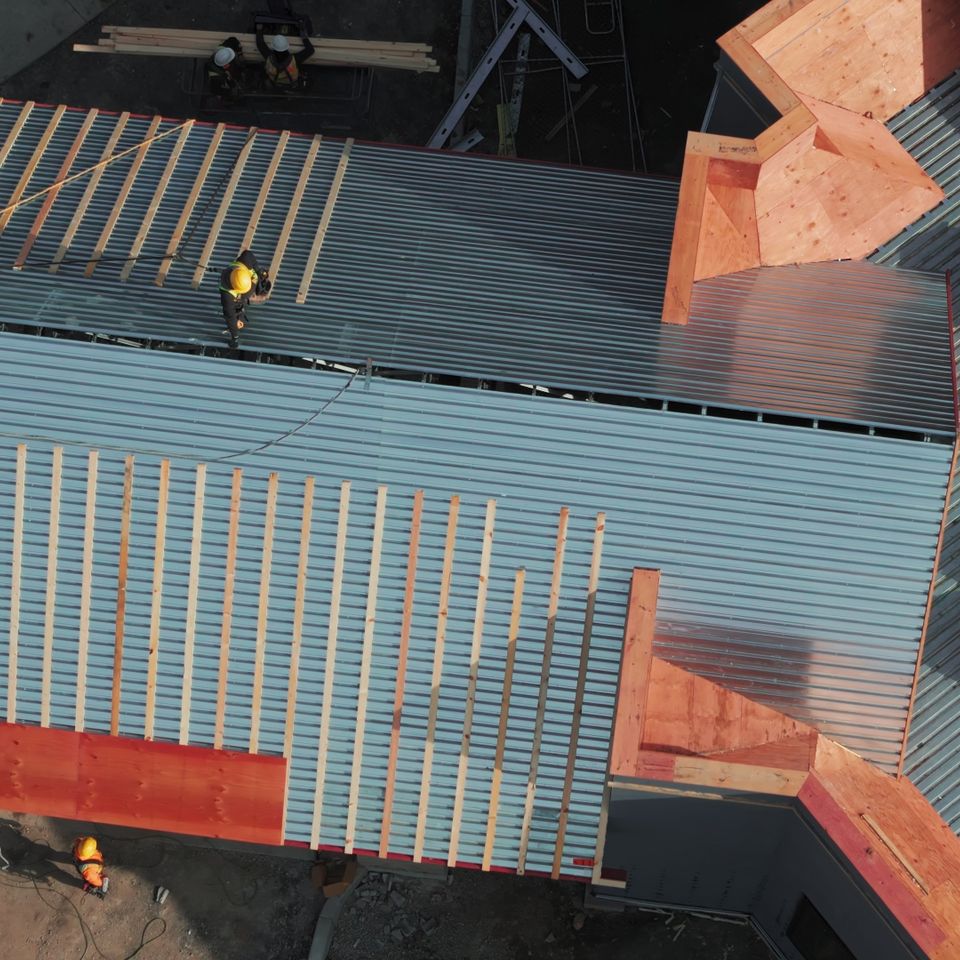 Industrial roof installing a new roof on an industrial building or warehouse drone vie sbi 351353030