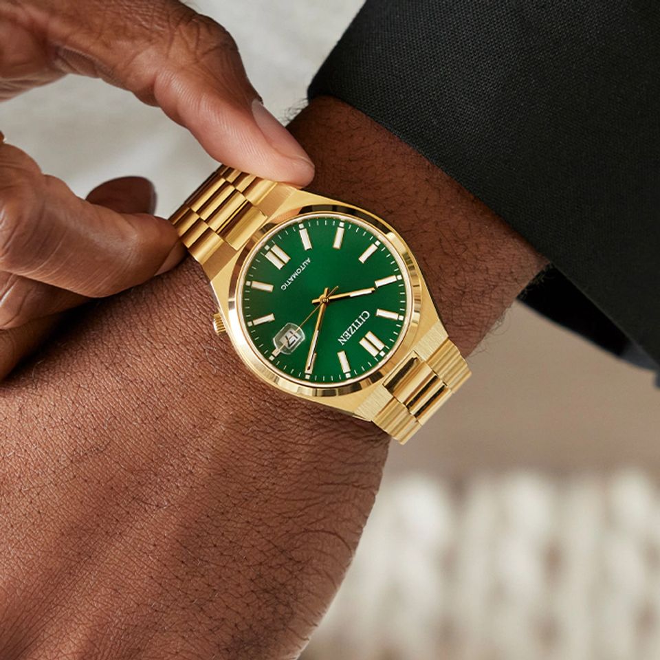 Gold Citizen Watch with Green face.