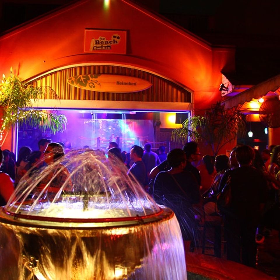 A view of the fountain in the courtyard of The Beach on Bourbon with a corporate event taking place in the background. 