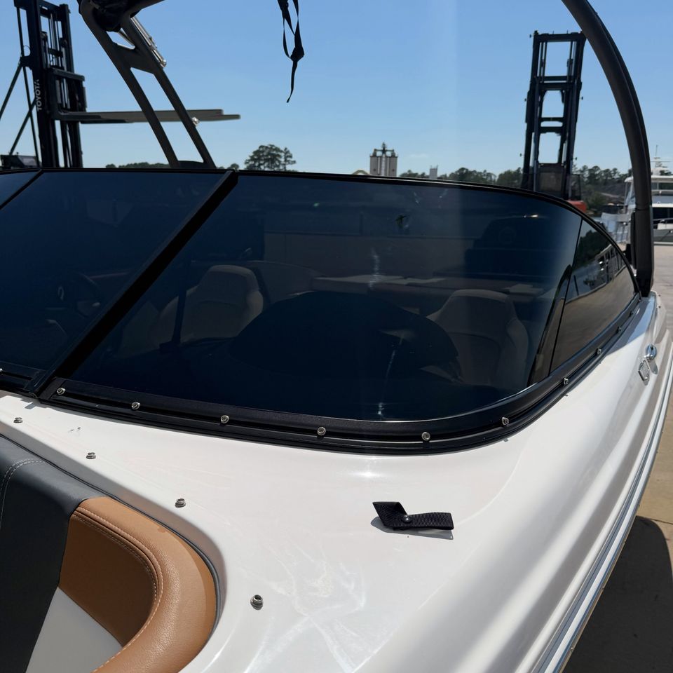 Bowrider boat windshield with dark marine tint applied at a Moyock NC boatyard