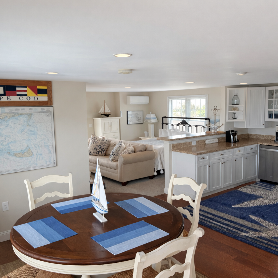 Regatta Suite open studio layout with king bed kitchen and living area