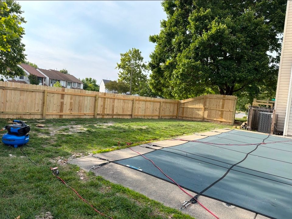 Wood privacy fence installation along backyard property line near pool in Virginia Beach VA 